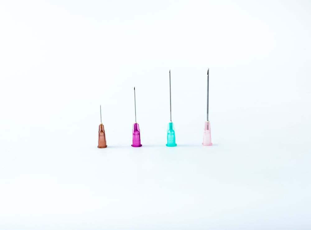 Four medical needles with attached cannulas